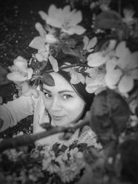 Portrait of woman with red leaves