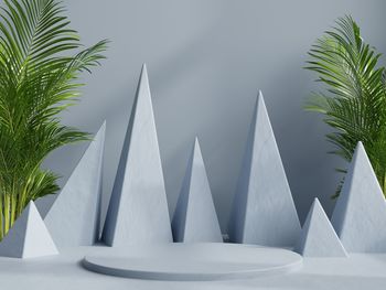 Mockup podium for product presentation with conical blue background.3d rendering