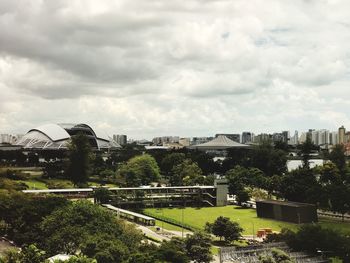 View of amusement park against cloudy sky