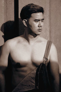 Portrait of young man looking away