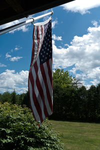 Flag against blue sky and clouds