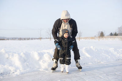 Full length of people on snow during winter