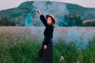 Full length of woman standing on field