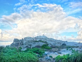 Scenic view of rocks on land against sky