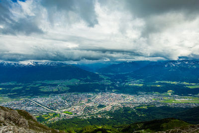 Scenic view of alps against cloudy sky