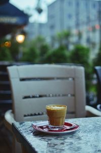 Close-up of coffee served on table at cafe