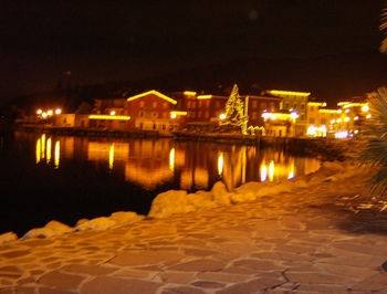 Reflection of illuminated buildings in water