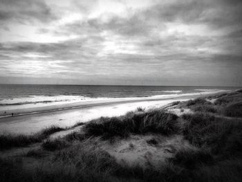 Scenic view of beach against sky