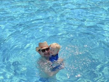 High angle view of man swimming in sea