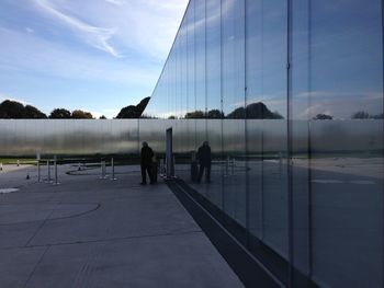 Reflection of people in water