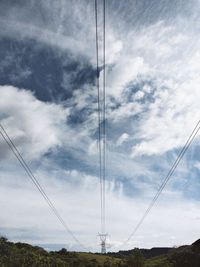 Low angle view of cables against sky