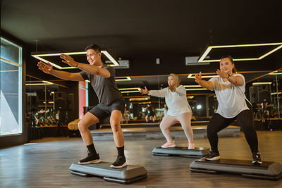 Rear view of woman exercising in gym