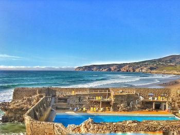 Scenic view of sea against blue sky