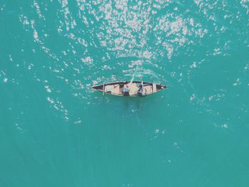 High angle view of boat sailing in sea