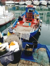 Boats moored at harbor