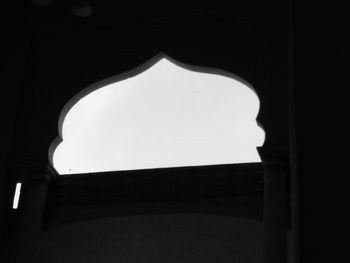 Low angle view of illuminated building against clear sky