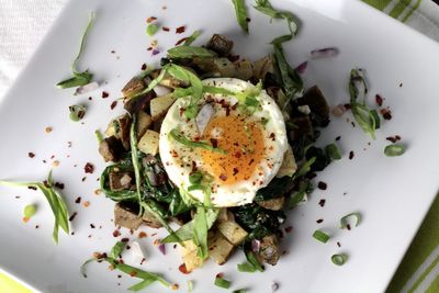 High angle view of potato with poached egg served in plate