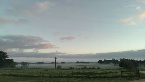 Scenic view of landscape against cloudy sky