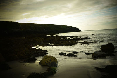 Scenic view of sea against sky at sunset