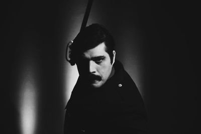 Portrait of male actor in darkroom