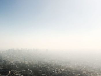 Aerial view of cityscape against sky