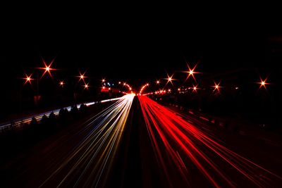 Light trails on illuminated city at night