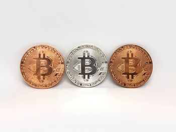 Close-up of coins on white background