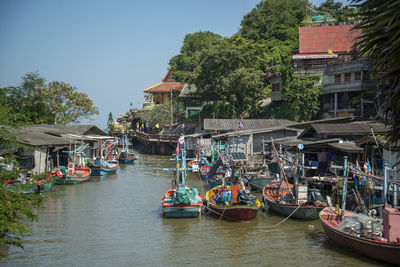 Boats moored at harbor