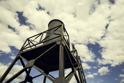 Water tank in the iron structure with the sky in the background