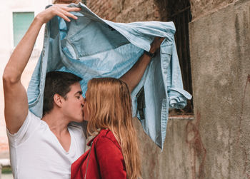 Portrait of couple kissing