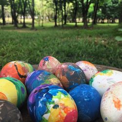 Close-up of multi colored balls in grass