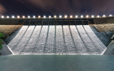 Flood discharge after raining, tai tam intermediate reservoir at night, hong kong