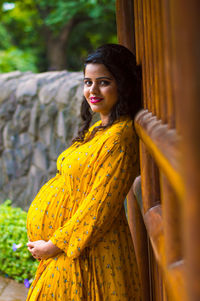 Portrait of a smiling young pregnant woman