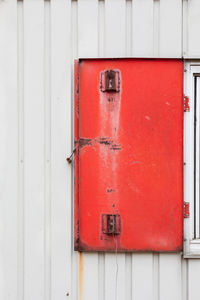 Close-up of red closed door of building