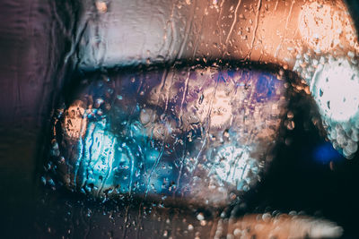 Full frame shot of wet glass window in rainy season