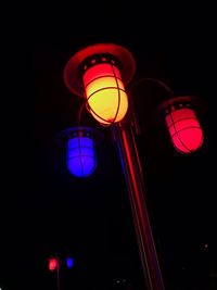 Low angle view of illuminated lanterns at night