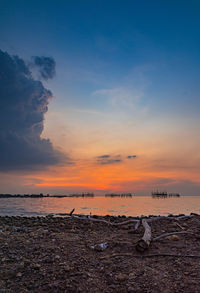 Scenic view of sea against sky during sunset