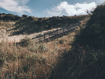 Panoramic shot of train on land against sky