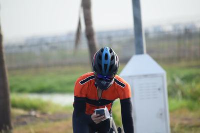 Rear view of man standing on field