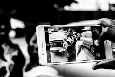 Close-up of man using mobile phone