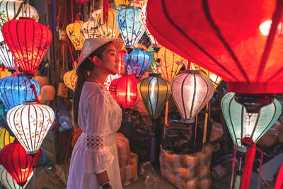 Full frame shot of illuminated lanterns hanging at night