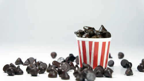 Close-up of coffee beans against white background