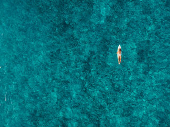 High angle view of man swimming in sea