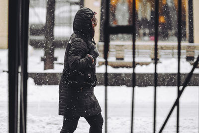  woman walking in snow