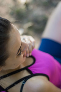 Close-up portrait of woman relaxing outdoors