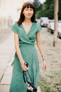 Portrait of woman standing in city