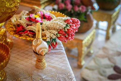 Close-up of religious offerings in temple