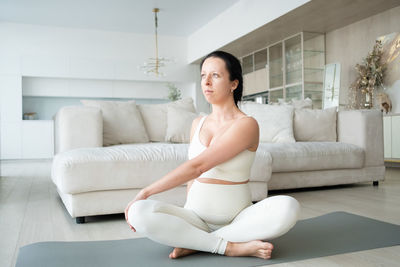 Pregnant woman meditating at home