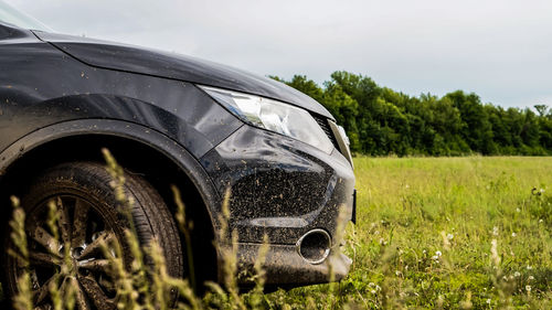 Close-up of car against sky