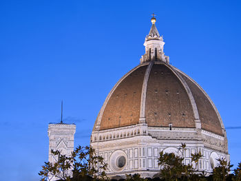 Low angle view of building against blue sky